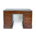 A Victorian mahogany twin pedestal desk with an arrangement of nine drawers with turned pulls, w.