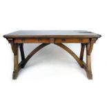 A Victorian Gothic oak centre table in the style of A.W.N. Pugin, the canted rectangular top