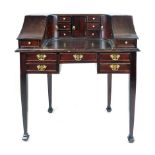 A mahogany 'Carlton House' style ladies writing desk, the superstructure with an arrangement of