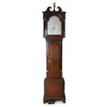 A George III oak and mahogany long cased clock, silver dial inscribed Geo. Baddeley, Newport,