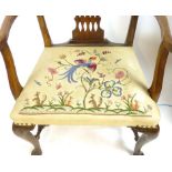 A George ll style mahogany elbow chair with pierced splat, tapestry upholstered seat, gently out