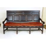 An 18th century five panel oak settle with block and turned stretchers, l. 182 cm  CONDITION REPORT: