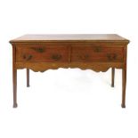 A late 18th century oak dresser base with diamond string inlay moulded top above two drawers and a