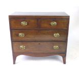 A Regency mahogany, crossbanded and inlaid chest of two short and two long drawers,