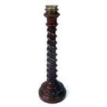 A late 19th century oak church candlestick,