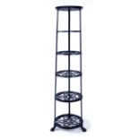 A block painted cast metal pot stand with six shelves, h.