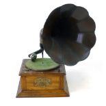 An oak cased Harts Pure-Tone gramophone with a flower-shaped horn,