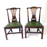 A pair of late 18th century mahogany and faux leather dining chairs,