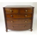 A Victorian mahogany bow fronted chest of drawers, with rope twist front supports and turned knobs,