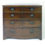 A George III mahogany, strung and inlaid chest of  two over three graduated drawers on bracket feet,