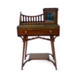An Arts and Crafts mahogany desk by Matthews and Co.