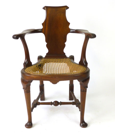 A reproduction George II style mahogany elbow chair,