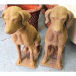 STONE DOG STATUES, a pair, 19th century 'Cotswold Stone' style, weathered finish, 75cm H and base