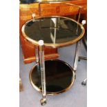 DRINKS TROLLEY, brass and perspex of two tiers with black circular glass, 80cm H x 50cm.