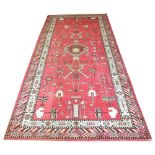 ANTIQUE SAMARKHAND KELLEH, 350cm x 170cm, cloud band design on cerise field within running dog