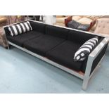 SOFA, with a metal frame and black upholstery, reputedly from Blake's Hotel, 213cm x 63cm H. (with
