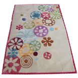 FINE BENNARES CARPET, 184cm x 124cm, polychrome flowerwheel design on gris field.