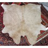 COWHIDE RUG, 205cm x 215cm, in cappuccino.