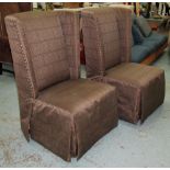 WING EASY CHAIRS, a pair, with a brown g