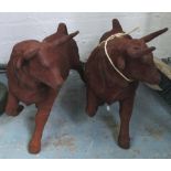 RACING BULLS, a pair, in cast iron rusti