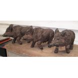 PIGS, a set of three, in coloured resin,