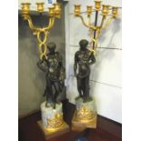 FIGURATIVE CANDELABRUM, a companion pair, Empire style, bronze and gilt metal, marble bases, 69cm H