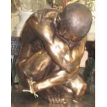 KNEELING MALE FIGURE, in resin, bronzed finish, 43cm H.