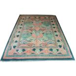 ARTS AND CRAFTS DESIGN CARPET IN MANNER OF VOYSEY, 380cm x 280cm, coral and jade floral pattern on