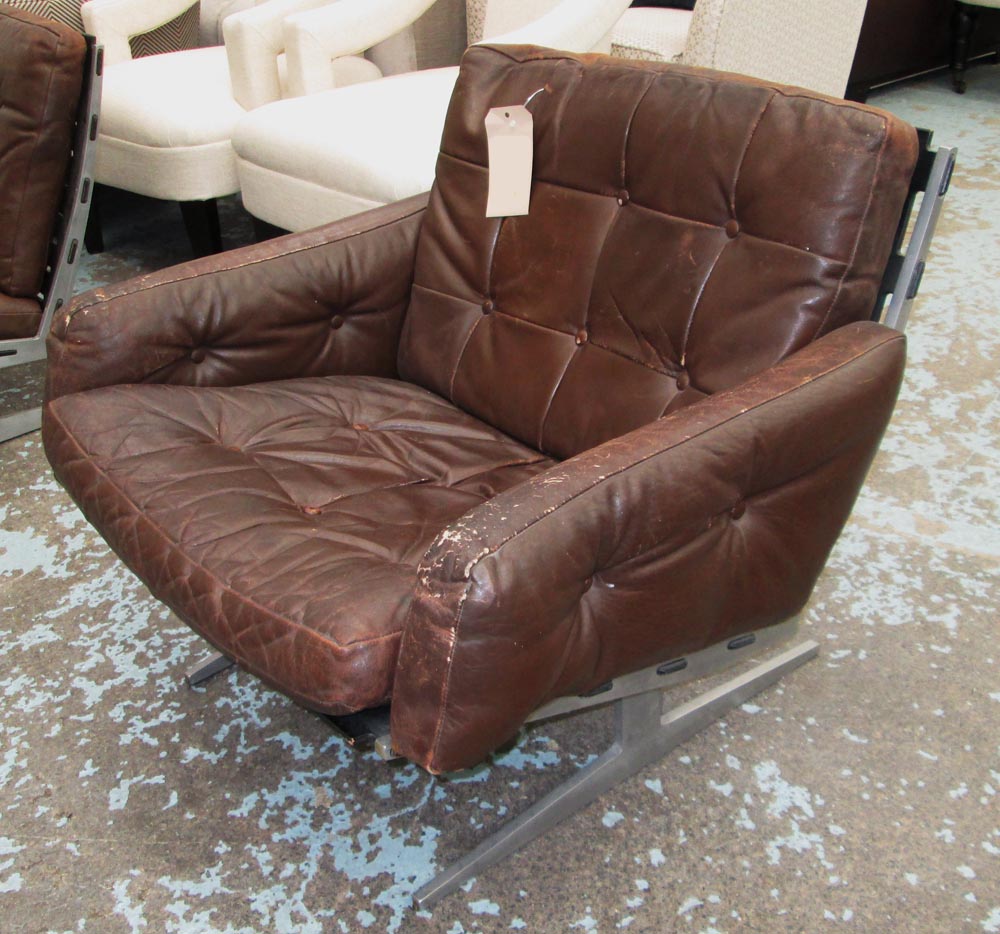 PAUL LEIDERSDORFF 1960'S LOUNGE CHAIRS, a pair, in distressed brown leather on metal supports, 77cm