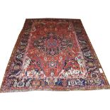 FINE ANTIQUE HERIZ SERAPI CARPET, 340cm x 250cm, central medallion on a terracotta field within