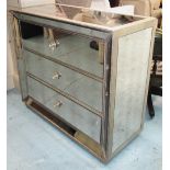 MIRRORED CHEST, continental style, having three long drawers in a cushioned mirrored front with