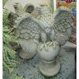 EAGLES, a pair, in reconstituted stone, 70cm H. (2)