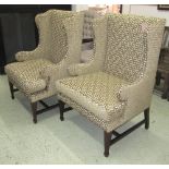 WINGBACK ARMCHAIRS, a pair, in cream with raised green geometric pattern fabric on square supports,