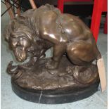 BRONZE STATUE OF A LION WITH SNAKE, on marble base, 41cm L.