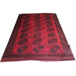 ANTIQUE AFGHAN CARPET, 313cm x 233cm, rows of elephant feet guls on a ruby field within bands and