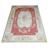 AUBUSSON STYLE NEEDLEPOINT, 270cm x 180cm, floral medallion on a rose field within an ivory floral