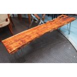 LOW BENCH/OCCASIONAL TABLE, cut from a tree trunk on metal supports, 170cm L.