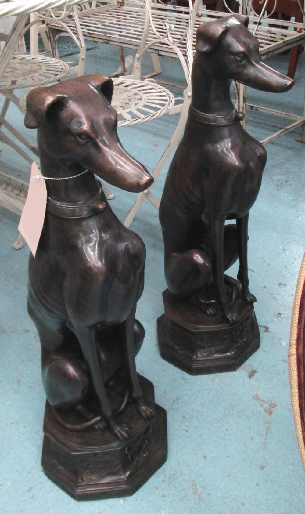BRONZE SEATED DOGS, a pair, 74cm H.