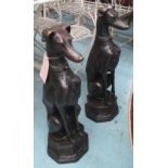 BRONZE SEATED DOGS, a pair, 74cm H.