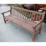 GARDEN BENCH, weathered teak of slatted construction with square supports, 182cm W.