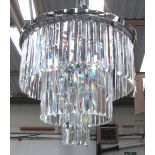 CHANDELIER, circular, with crystal drops on a three tiered chromed metal frame, 46cm H, plus chain.