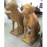 GARDEN STONE DOG STATUES, a pair, Cotswold stone style weathered finish, 75cm H x 32cm x 26cm.