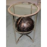 OCCASIONAL TABLE, chrome framed with circular glass top above a black globe, 61cm H x 42cm.