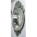 WALL MIRROR, Venetian style, with a central oval bevelled plate and etched decoration,