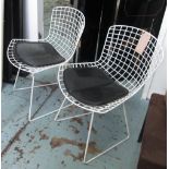 DINING CHAIRS, a set of four, Bertoia style on a white metal frame with cushions, 54cm W.