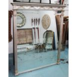 OVERMANTEL MIRROR, in a silvered finish with ribbon and leaf decoration and a rectangular plate,