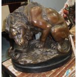 BRONZE STATUE, of a lion with a snake on a marble base, 42cm L.