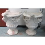 URNS, a pair, white painted reconstituted stone with swag detail, 79cm H.
