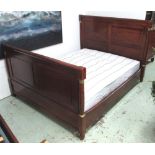 DOUBLE BED, Empire style with gilt metal mounts and a mattress, 130cm H x 175cm W.