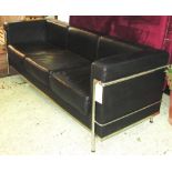 SOFA, Le Corbusier style chrome framed in black leatherette with three seat cushions,